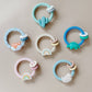 *NEW OPTION* Ritzy Rattle™ Silicone Teether Rattles: Highland Cow